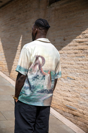 model wearing represent resort shirt with greek iconography to the reverse