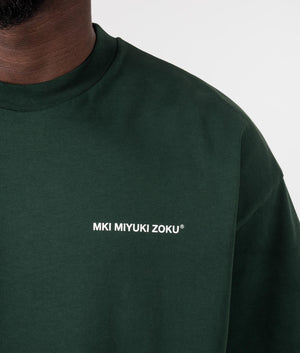 Oversized Uniform T-Shirt in Green from MKI MIYUKI ZOKU. Front Detail Shot at EQVVS.