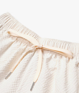 Relaxed Fit Seersucker Trousers In Off White by MKI MIYUKI ZOKU. EQVVS Detail Shot.