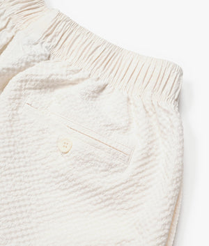 Relaxed Fit Seersucker Trousers In Off White by MKI MIYUKI ZOKU. EQVVS Detail Shot.