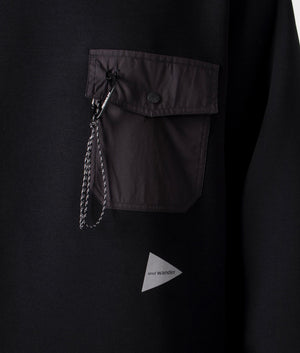 Airly warm sweatshirt by and wander in black. shot at EQVVS. Detail shot. 