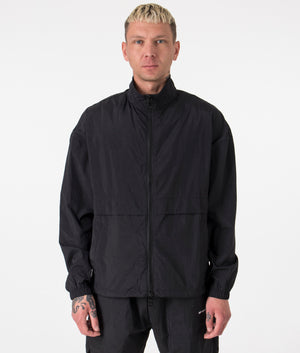 Oversized Crinkle Nylon Track Jacket in Black by MKI MIYUKI ZOKU. EQVVS Front Angle Shot.