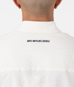 MKI Oversized Seersucker Dress Shirt in Off White. Detail angle model shot at EQVVS.