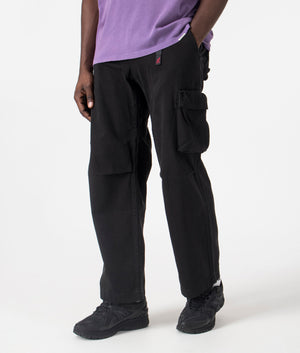 Gramicci Relaxed Fit Rig Cargo Pants in Black, 100% Organic Cotton. At EQVVS Menswear. Front angle shot.