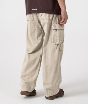 Gramicci Rig Cargo Pants in Pigment Oat with elasticated belt, 100% cotton. At EQVVS Menswear, back shot. 