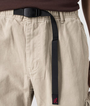 Gramicci Rig Cargo Pants in Pigment Oat with elasticated belt, 100% cotton. At EQVVS Menswear, detail logo shot. 