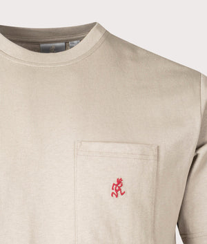 Gramicci One Point T-shirt in Smoky Sand, Beige with embroidered pocket logo, 100% cotton at EQVVS menswear. Detail logo shot. 