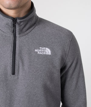 The North Face Quarter Zip 100 Glacier Fleece in Medium Grey Heather. Shot at EQVVS. Detail shot model. 