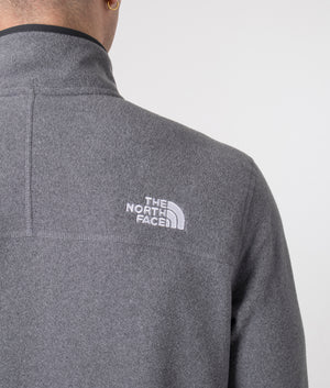 The North Face Quarter Zip 100 Glacier Fleece in Medium Grey Heather. Shot at EQVVS.  Detail shot model. 