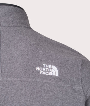 The North Face Quarter Zip 100 Glacier Fleece in Medium Grey Heather. Shot at EQVVS. Detail shot mannequin. 