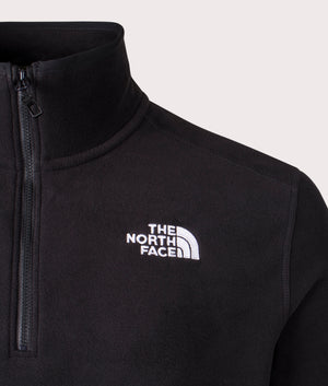 The North Face Quarter Zip 100 Glacier Fleece in Black at EQVVS. Front Detail Shot.