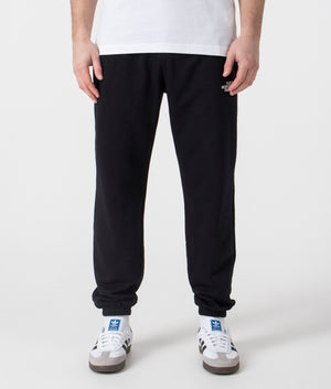 The North Face Simple Dome Light Tapered Joggers in Black. Shot at EQVVS.  Front model shot. 