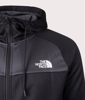 The North Face Reaxion Fleece Zip Through Hoodie in Black and Asphalt Grey at EQVVS. Front Detail Shot.