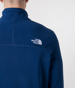 The North Face Quarter Zip 100 Glacier Fleece in Estate Blue. Shot at EQVVS.  Detail model shot. 