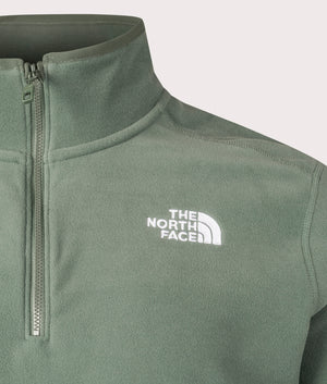 The North Face Quarter Zip 100 Glacier Fleece in Duck Green. Front Detail Shot at EQVVS.