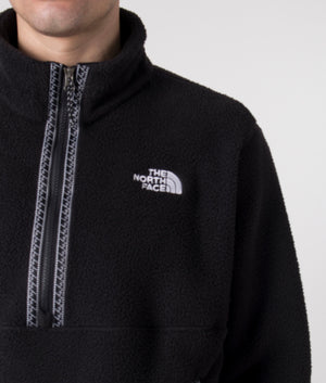 The North Face TNF Quarter Zip Fleeski in Black. Shot at EQVVS. Model detail shot. 