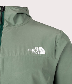 The North Face Mountain Athletic Hooded Wind Jacket in Duck Green. Front Detail Shot at EQVVS.