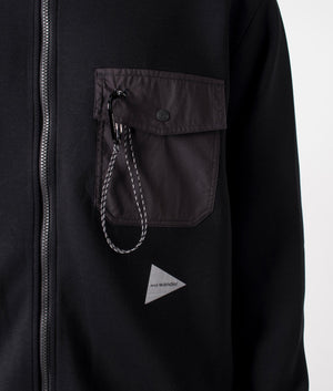 and wander Airly Full Zip Sweatshirt in black. Shot at EQVVS. Detail shot. 