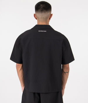 MKI Oversized Seersucker Vacation Shirt in Black. Back angle model shot at EQVVS.