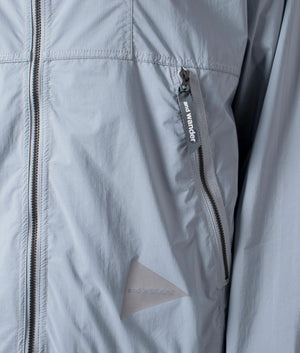 Nylon pertex jacket in light blue by and wanrder. shot at EQVVS. Detail shot. 