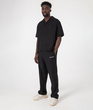 MKI Relaxed Fit Tencel Trousers in Black. Full front angle model shot at EQVVS.