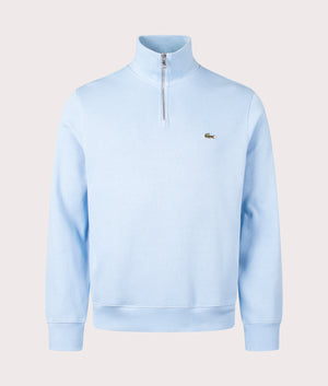 Lacoste Quarter Zip Croc Logo Sweatshirt in HBP Pale Blue, 100% Cotton. At EQVVS Menswear. Front detail shot