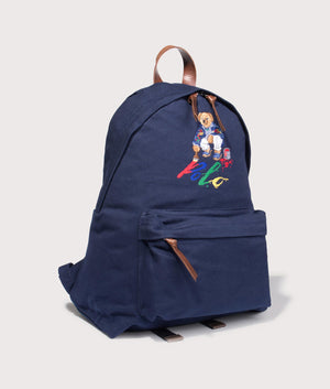 Polo Ralph Lauren Polo Bear Canvas Backpack in Newport Navy. Side angle shot at EQVVS.