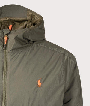 The Polo Ralph Lauren Teak Stretch Hooded Jacket in Canopy Olive at EQVVS. Detailed Logo Shot. 