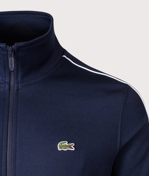 Lacoste Paris Piqué Zip Through Track Top in Navy Blue. Shot at EQVVS. Detail shot. 