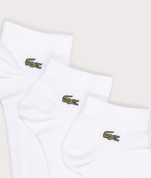 Lacoste 3 Pack Low Socks in White . Shot at EQVVS. Logo shot 