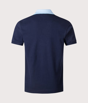 Lacoste Ribbed Collar Polo Shirt in Navy Blue. Shot at EQVVS.  Back shot. 