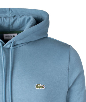 Lacoste Brushed Cotton Fleece Hoodie in Limestone. Shot at EQVVS. 