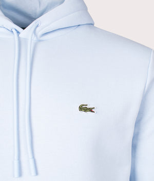 Lacoste Relaxed Fit Brushed Fleece Hoodie in Rill. Shot at EQVVS. Detail shot