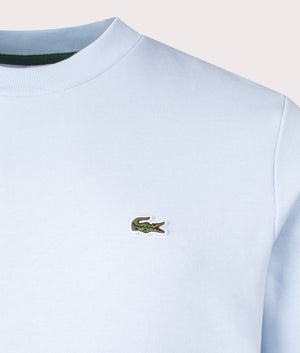 Lacoste Relaxed Fit Organic Brushed Cotton Sweatshirt in Rill. Shot at EQVVS. Detail shot