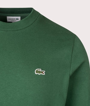 Lacoste Relaxed Fit Organic Brushed Cotton Sweatshirt in Green. Detail angle shot at EQVVS.