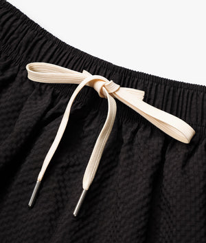 Relaxed Fit Seersucker Trousers in Black by MKI MIYUKI ZUKO, EQVVS Detail Shot.