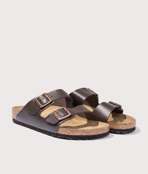 Arizona Natural Leather Sandals in Dark Brown by Birkenstock. EQVVS Shot.