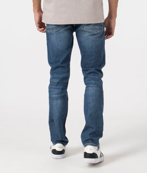 BOSS Slim Fit Delaware Comfort Stretch Jeans in Dark Blue. Back angle shot at EQVVS.