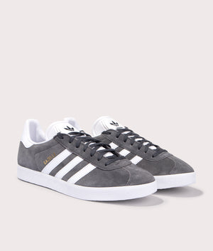 adidas Originals Gazelle trainers in Dark Grey/White/Gold Metallic, leather and suede upper. Front pair shot. 