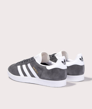 adidas Originals Gazelle trainers in Dark Grey/White/Gold Metallic, leather and suede upper. Back pair shot. 