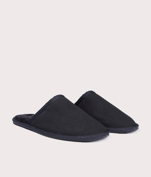 Home Slippers in Black from BOSS. Side angle shot at EQVVS.