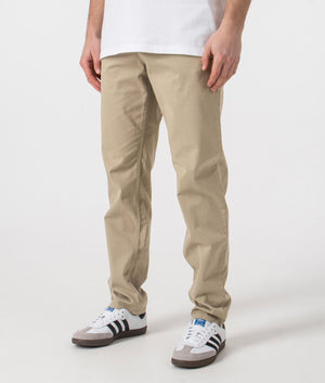 BOSS Tapered Fit Chinos in brown. Shot at EQVVS. Side shot. 