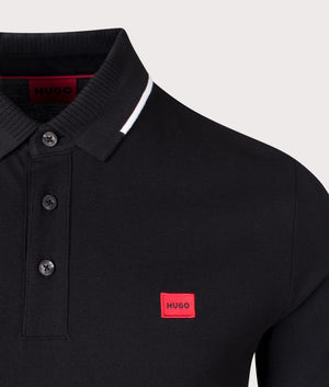 HUGO Slim Fit Deresino 232 Polo Shirt in Black. 100% Cotton. At EQVVS Menswear. Front logo shot