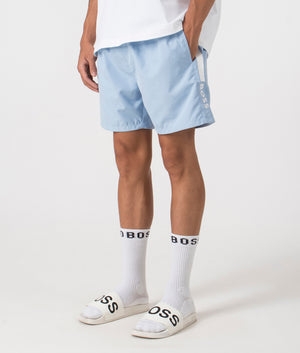 Dolphin Swim Shorts in pastel blue by BOSS. Shot at EQVVS. Side shot. 