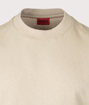 HUGO Relaxed Fit Dapolino T-Shirt in Open Beige. Detail angle shot at EQVVS.