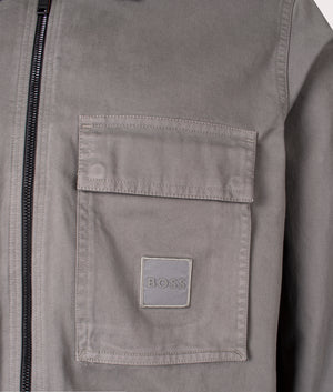 Oversized Lovel Zip 13 Overshirt in Open Grey from BOSS. Detail angle shot at EQVVS.