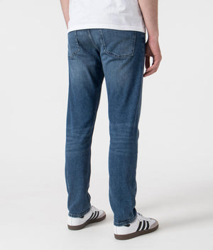 BOSS Slim Fit Delaware Jeans in Medium Blue . Shot at EQVVS. Back shot