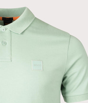 Slim fit Passenger Polo Shirt by BOSS. Light Pastel Green. Shot at EQVVS. Detail shot. 