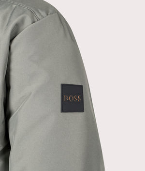 BOSS Relaxed Fit Osis Parka Jacket in Open Grey, 100% Polyamide. Angle Shot at EQVVS