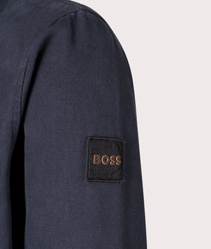 BOSS Lerato Overshirt in Dark Blue, 100% Cotton. Shot at EQVVS. Detail shot. 